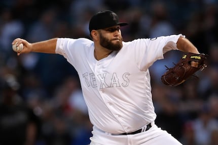 Texas Rangers starting pitcher Lance Lynn delivers during the first inning of a baseball...