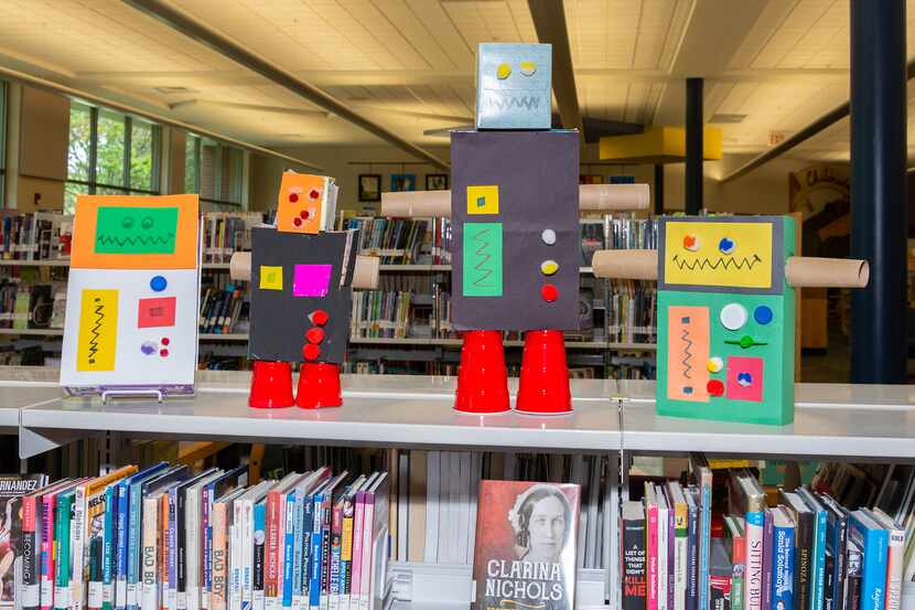 Plano Public Library librarians showed how to make a robot bank for Upcycled Engineering...