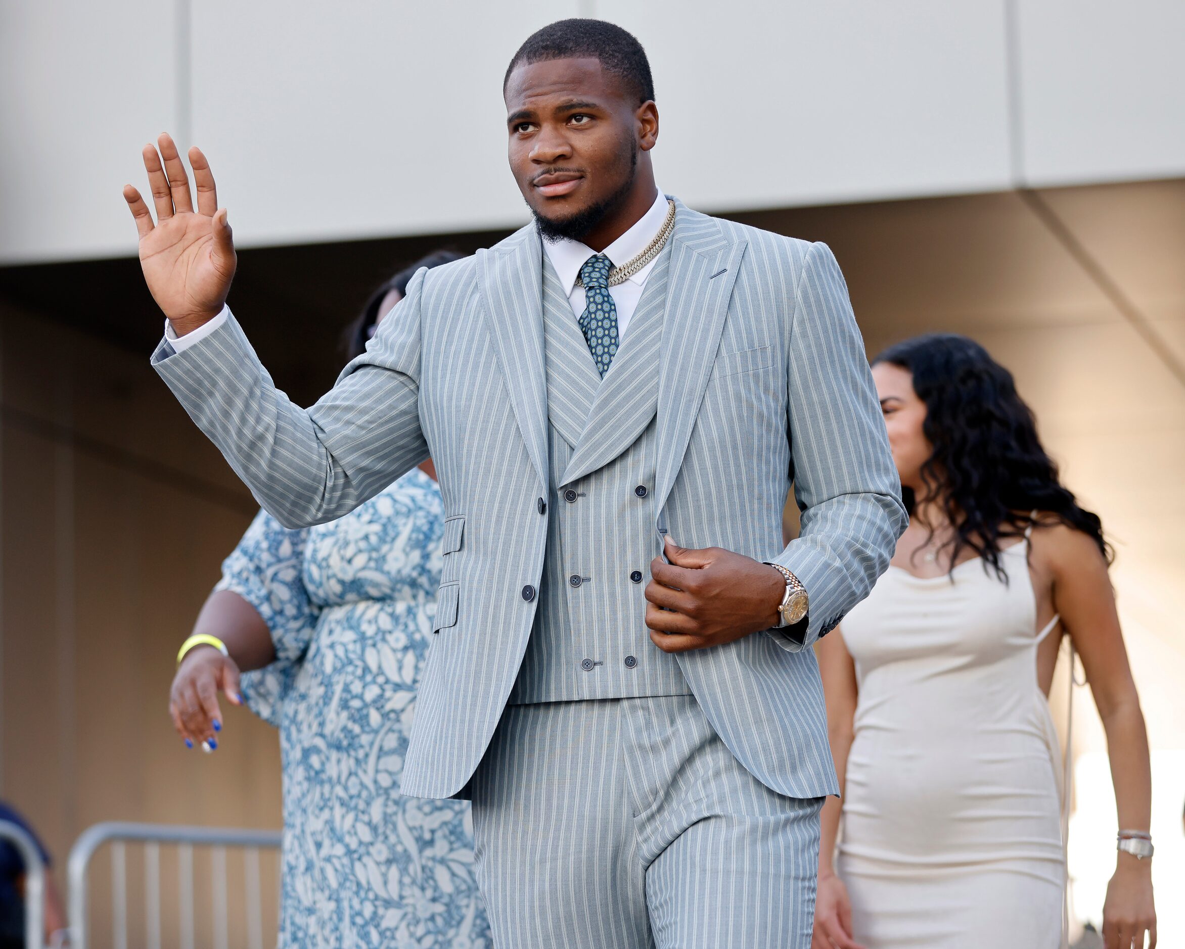 Dallas Cowboys linebacker Micah Parsons waves to fans as he arrives to the Dallas Cowboys...