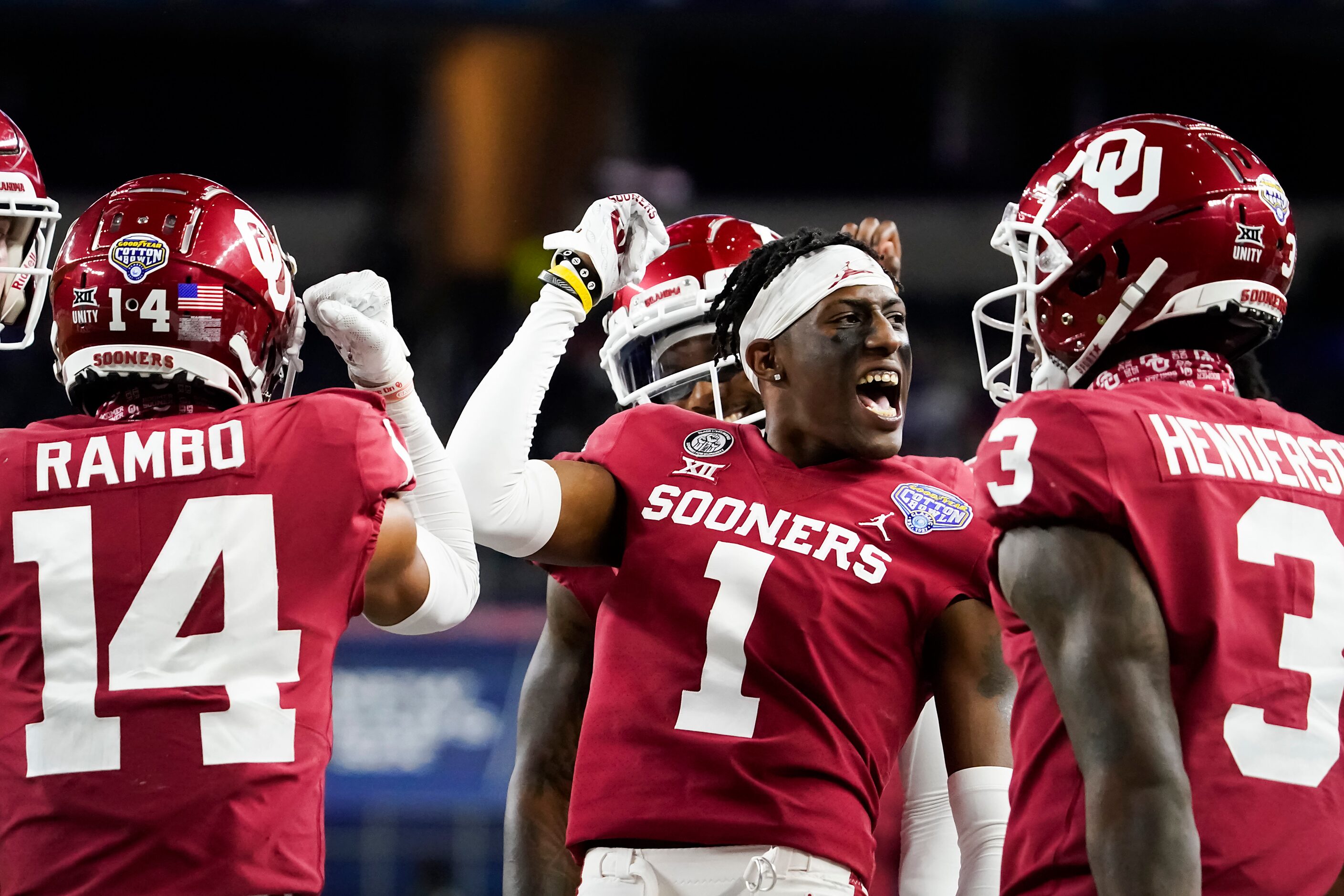 Oklahoma cornerback Joshua Eaton (1) celebrates with wide receiver Charleston Rambo (14)...