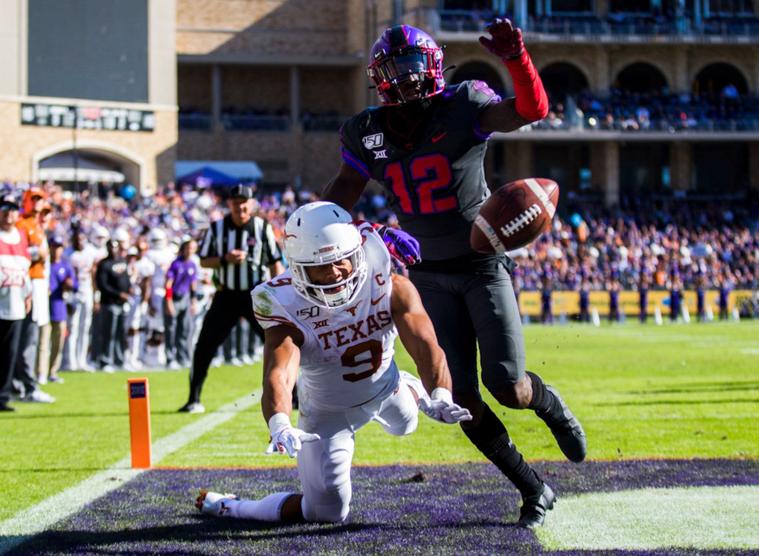 Texas Longhorns wide receiver Collin Johnson (9) is tripped up short of a pass in the end...