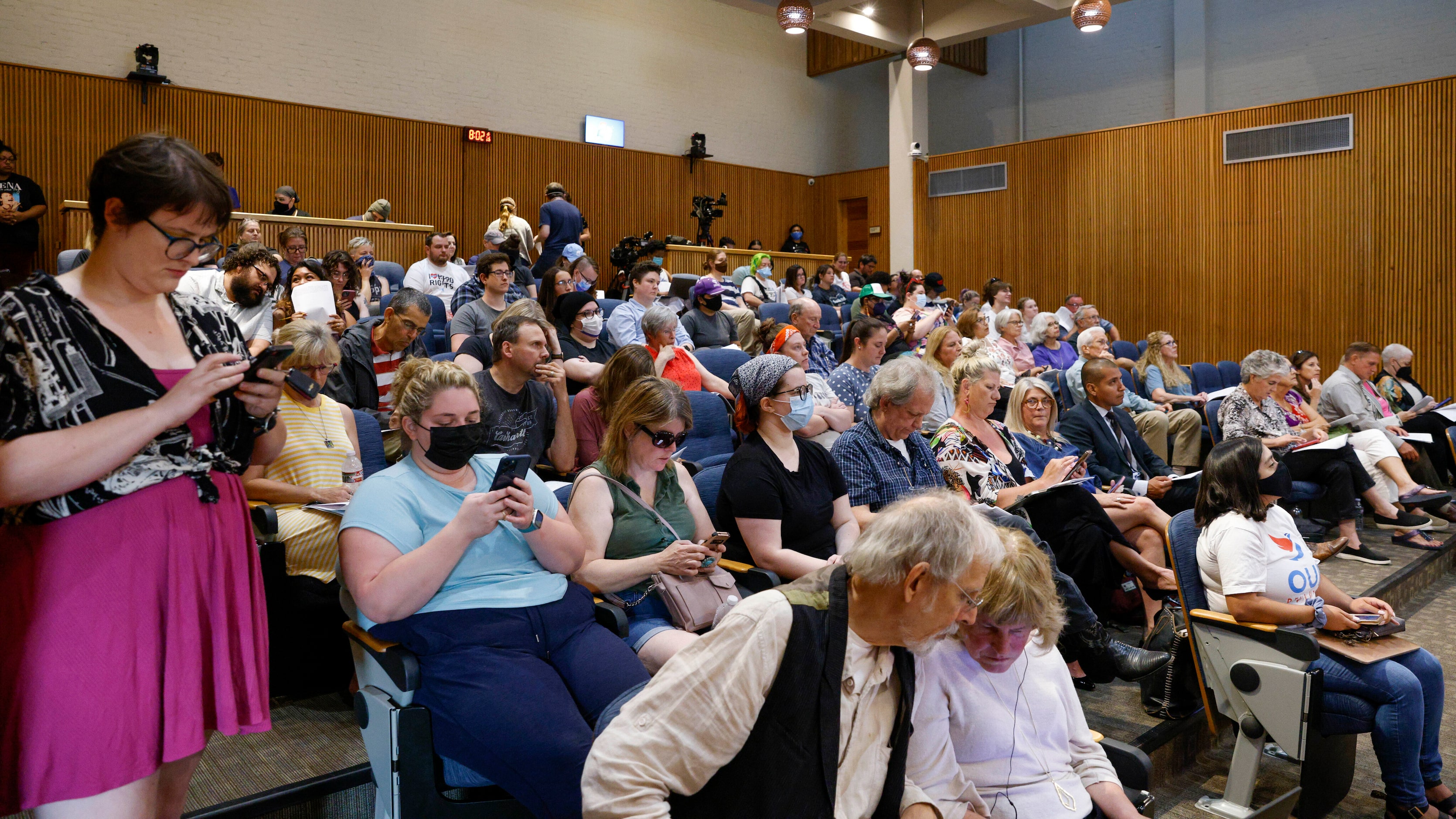 People fill the Denton City Council chambers during a meeting at Denton City Hall in Denton,...