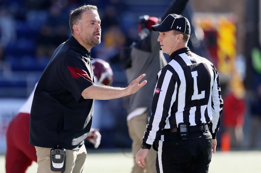 ANNAPOLIS, MD - DECEMBER 03: Head coach Matt Rhule of the Temple Owls talks with line judge...