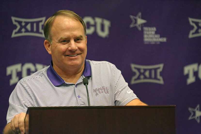 Head Coach Gary Patterson is pictured during a media briefing at the podium in the Four...