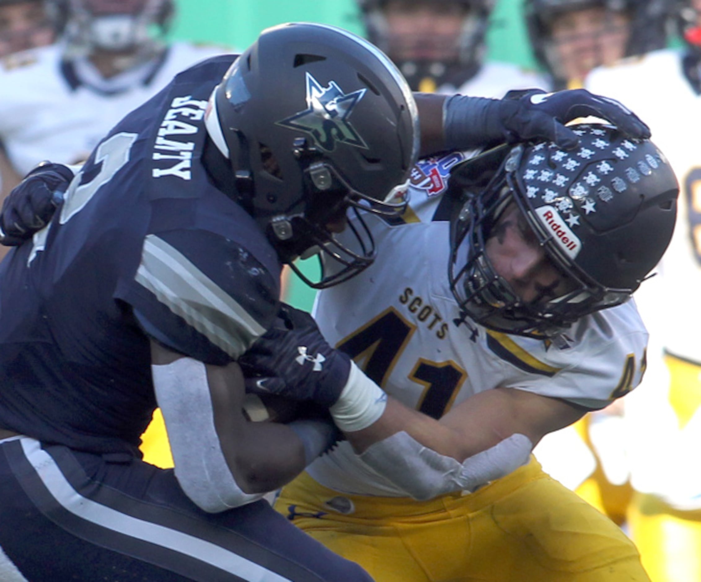 Frisco Lone Star's Ashton Jeanty (2), left, is stopped after a short gain by Highland Park...