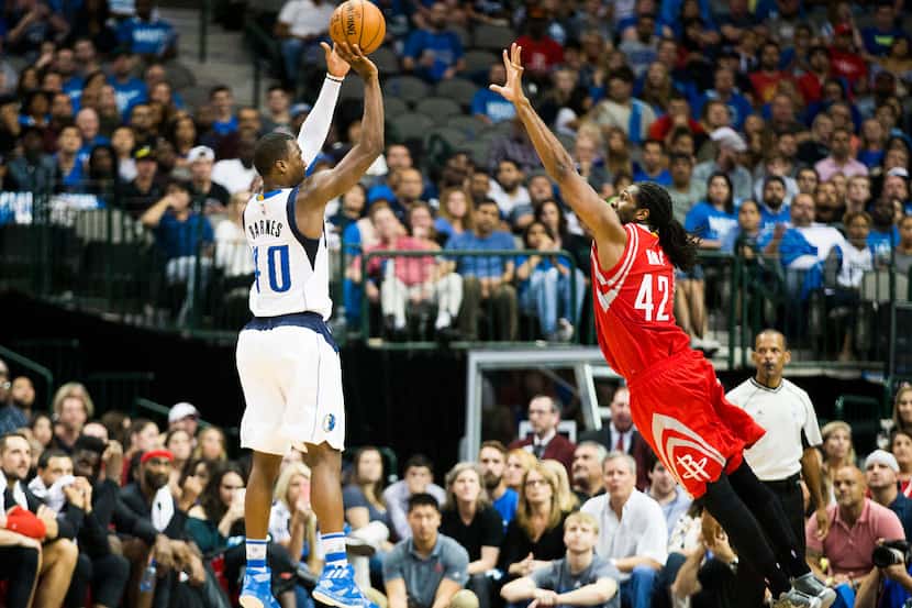 Dallas Mavericks forward Harrison Barnes (40) shoots a 3-pointer over Houston Rockets center...