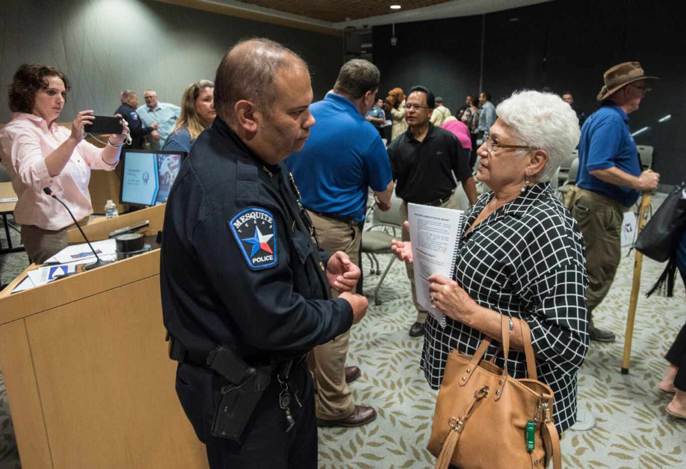 Mesquite Police Chief Charlie Cato listens to a concern from Nancy Mallow after a town hall...