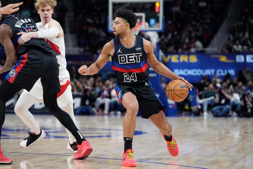 Detroit Pistons guard Quentin Grimes controls the ball during the second half of an NBA...
