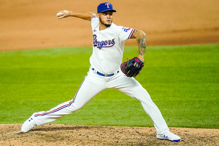 Texas Rangers pitcher Jonathan Hernandez pitches during the eighth inning against the...