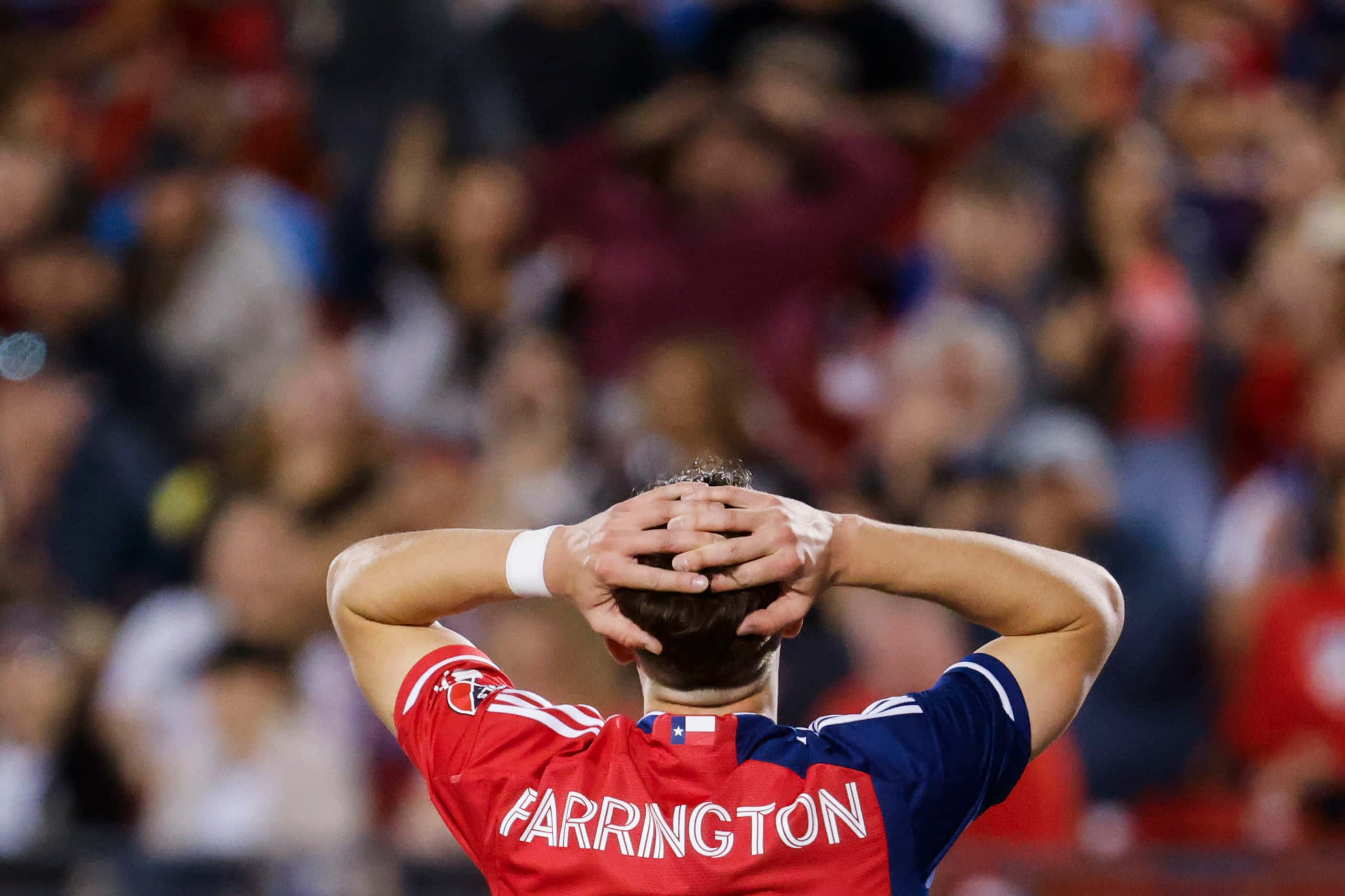 FC Dallas’ Logan Farrington reacts after missing to score during the first half of an MLS...