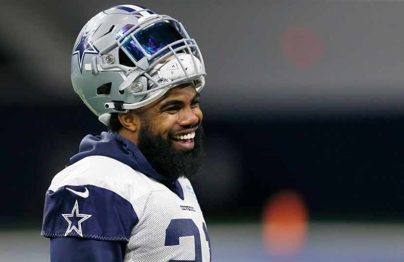 Dallas Cowboys running back Ezekiel Elliott (21) laughs during practice in the Ford Center...