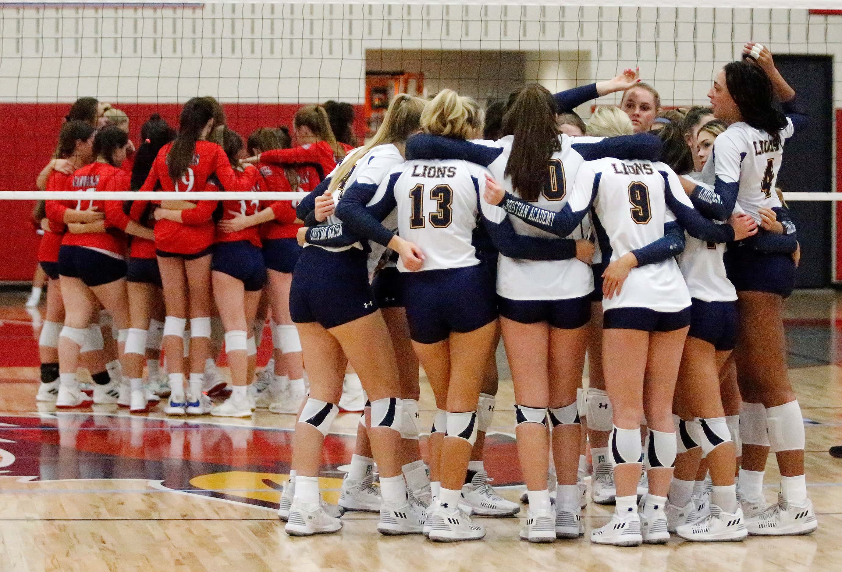 Both teams huddle before the start of the match as John Paul II High School hosted...