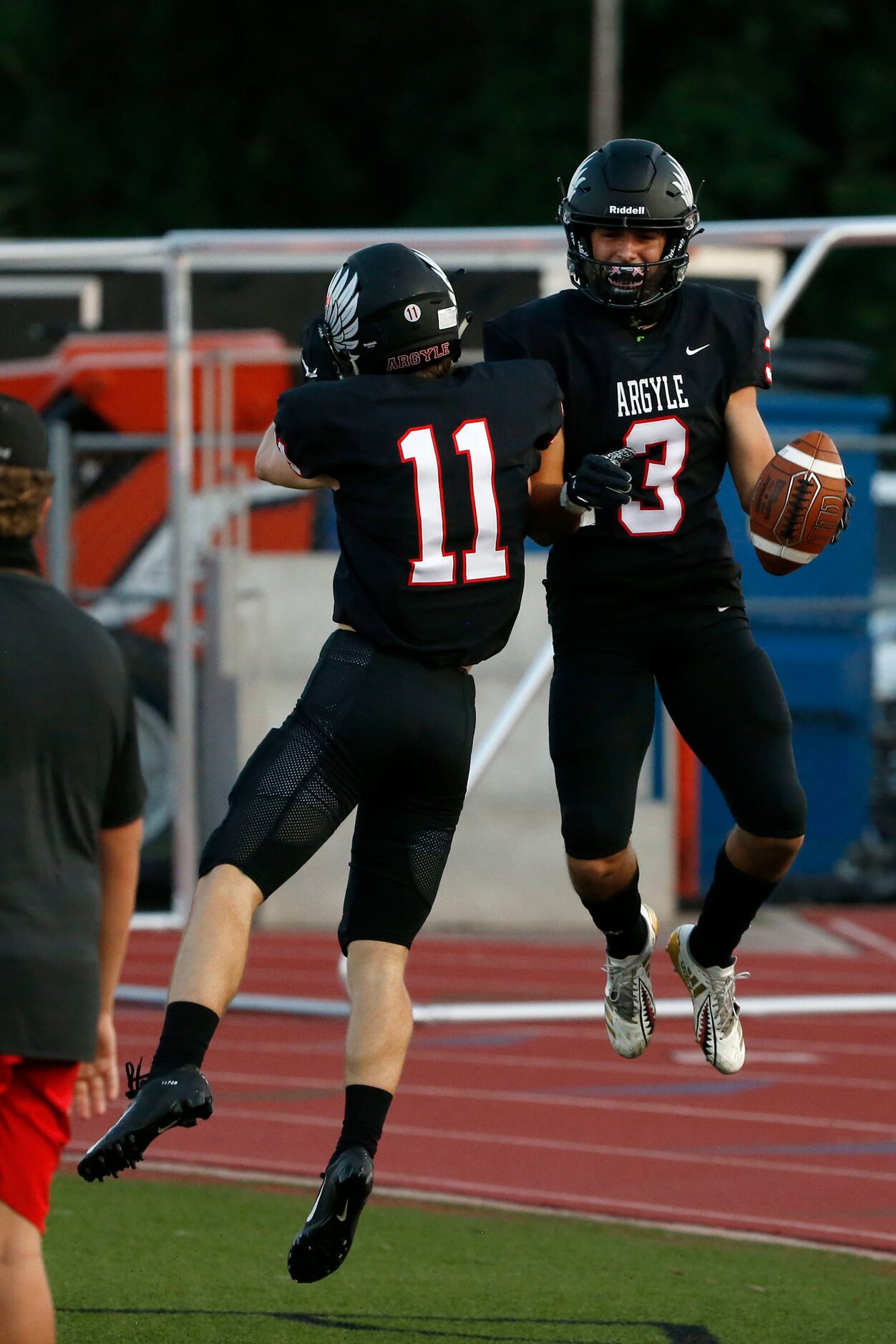 Argyle's Ward McCollum celebrates a touchdown by receiver Cash Walker (3) against Decatur,...