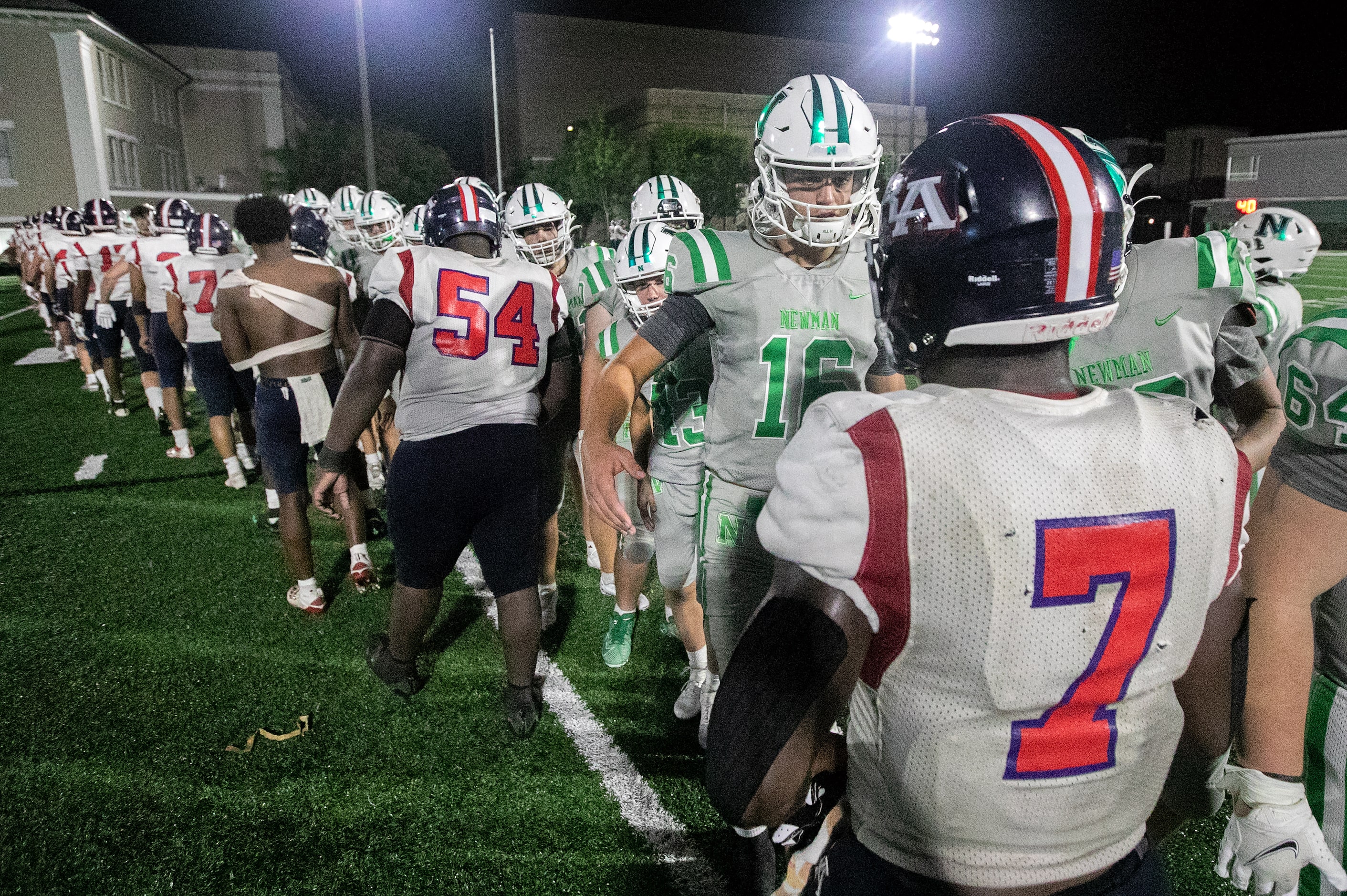 Arch Manning shakes hands with referees, coaches and opponents as Newman High School defeats...