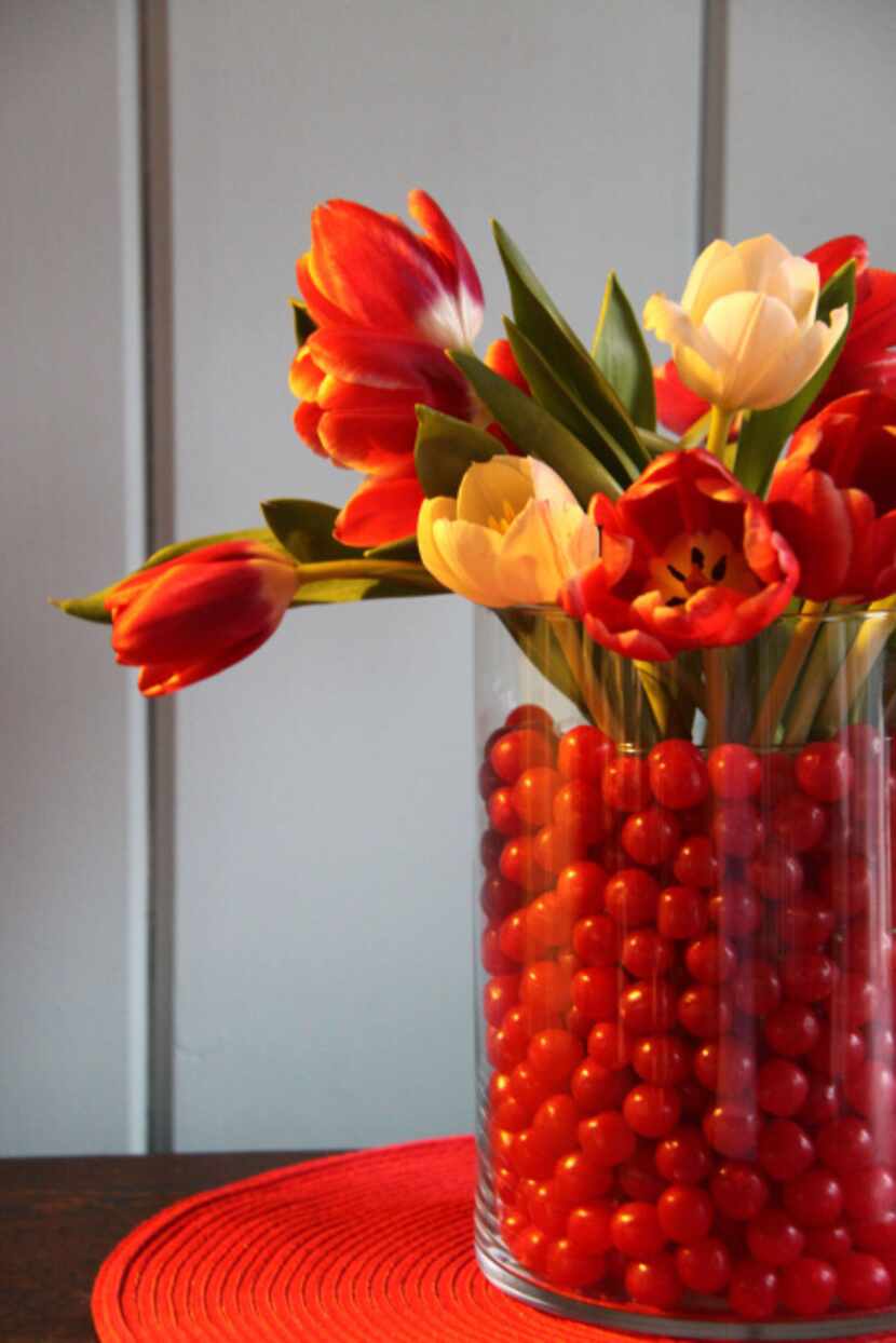 Use two glass cylindrical vases, one narrower than the other but about the same height or a...