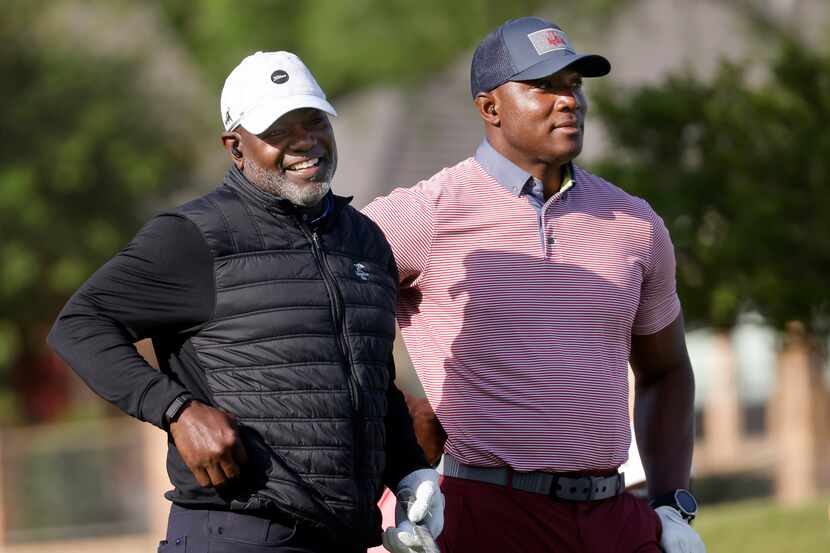Former Dallas Cowboys football players Emmitt Smith (left) and DeMarcus Ware were paired up...