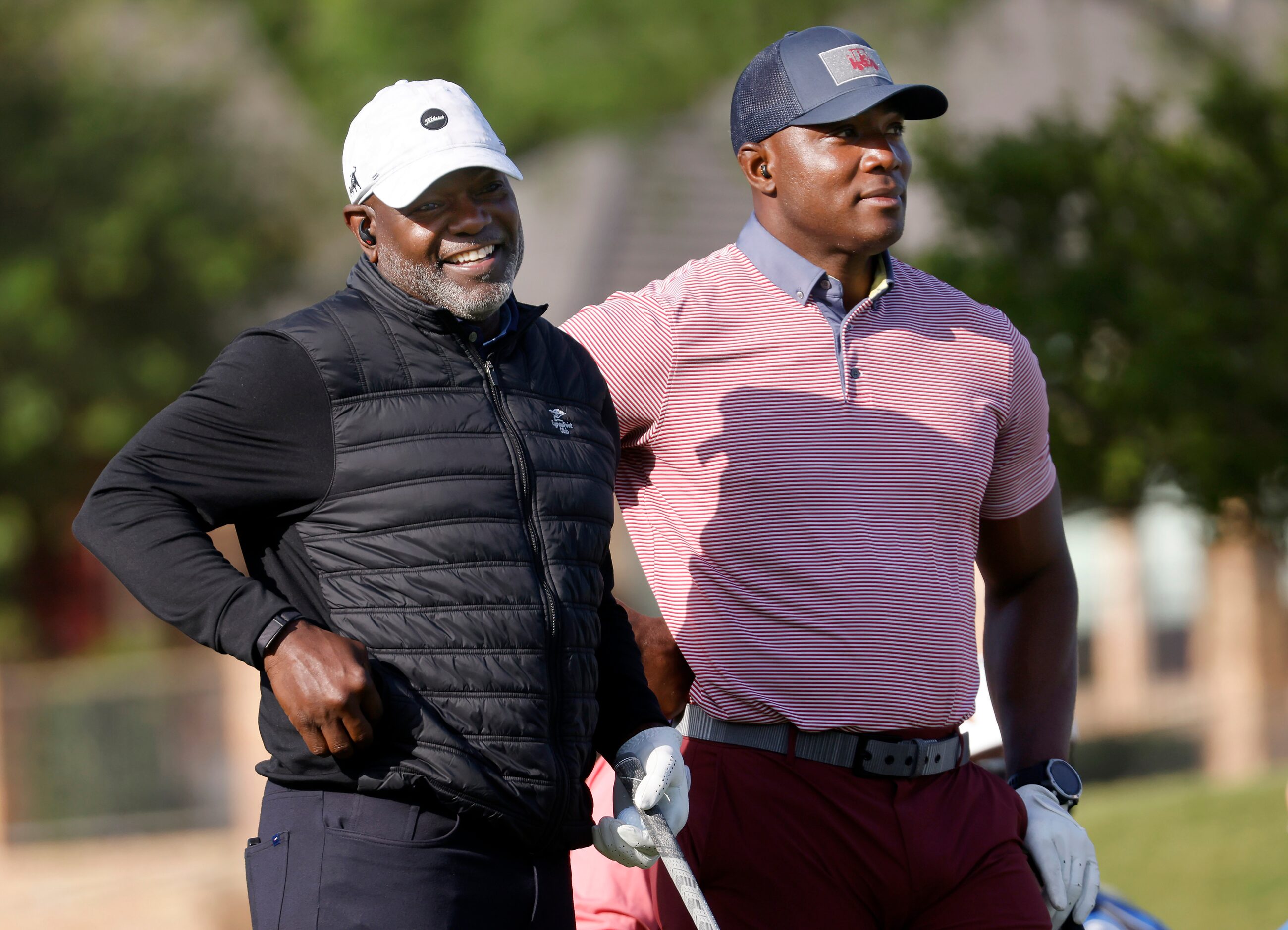 Former Dallas Cowboys football players Emmitt Smith (left) and DeMarcus Ware were paired up...