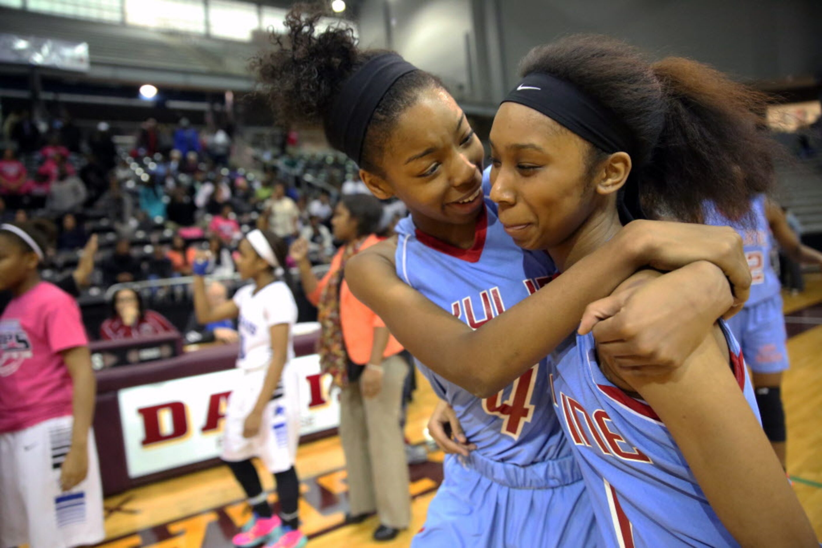 Skyline guard Raven Johnson (left) and guard Christalah Lyons (right) celebrate their...