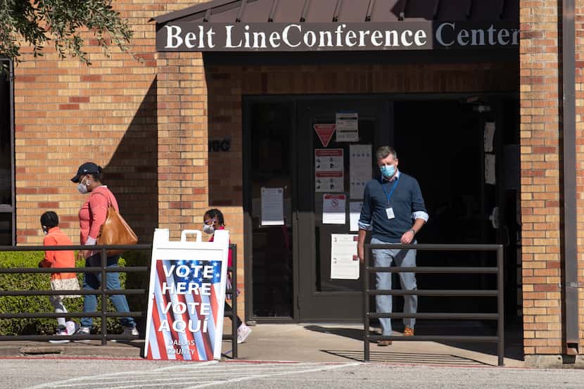 Voters walk out of the Belt Line Conference Center in DeSoto after casting their ballot in...