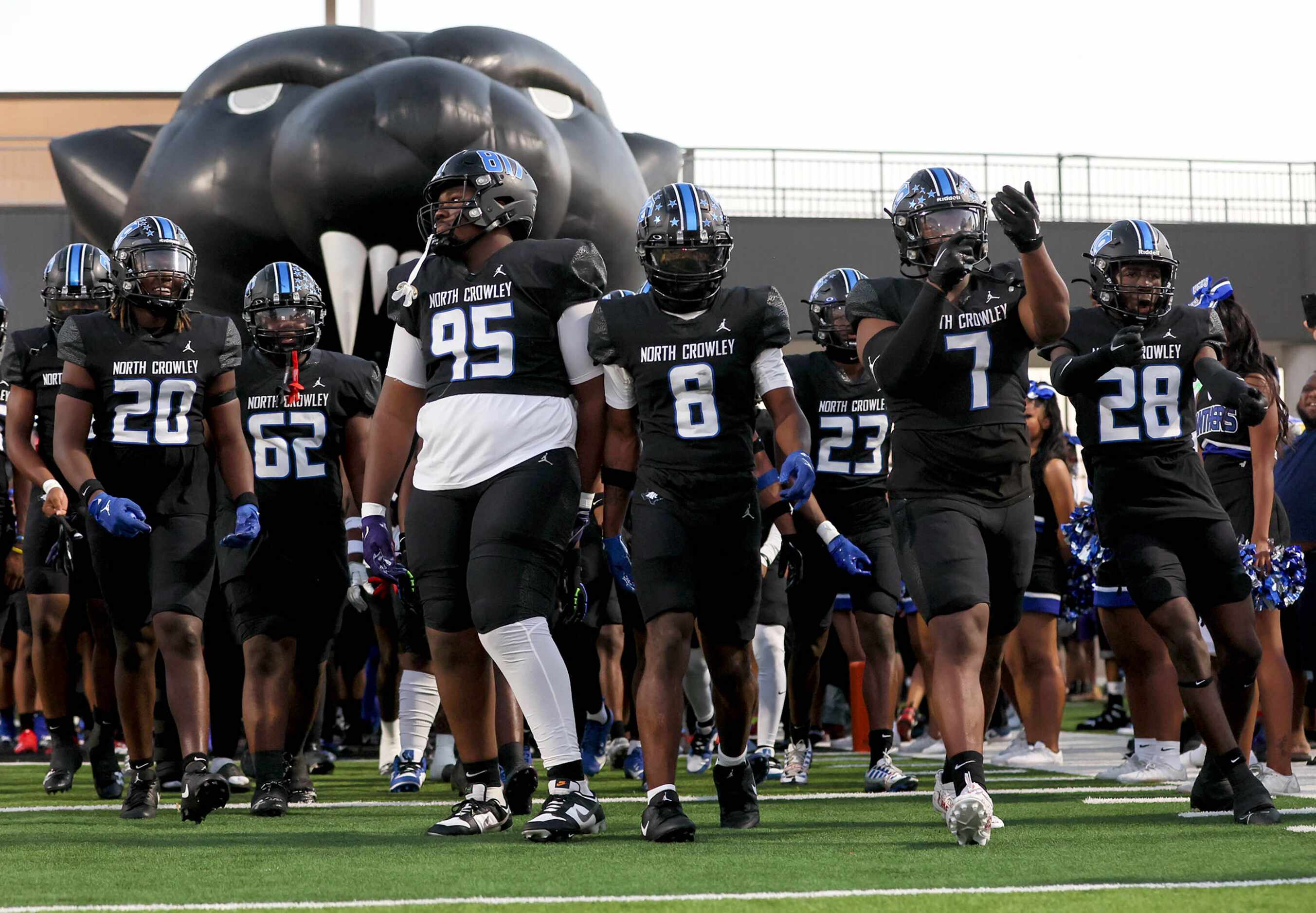 The North Crowley Panthers enter the field to face Euless Trinity in a high school football...