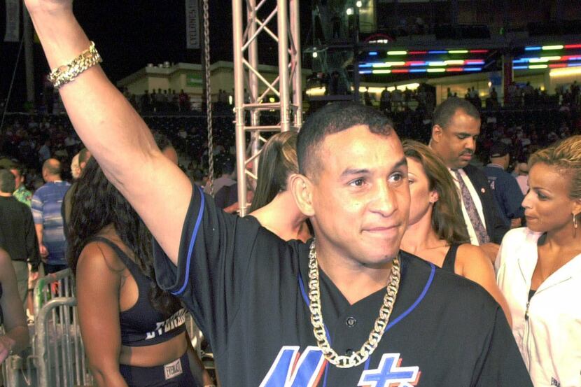 FILE -  In this July 7, 2001 file photo, boxing champ Hector "Macho" Camacho acknowledges...