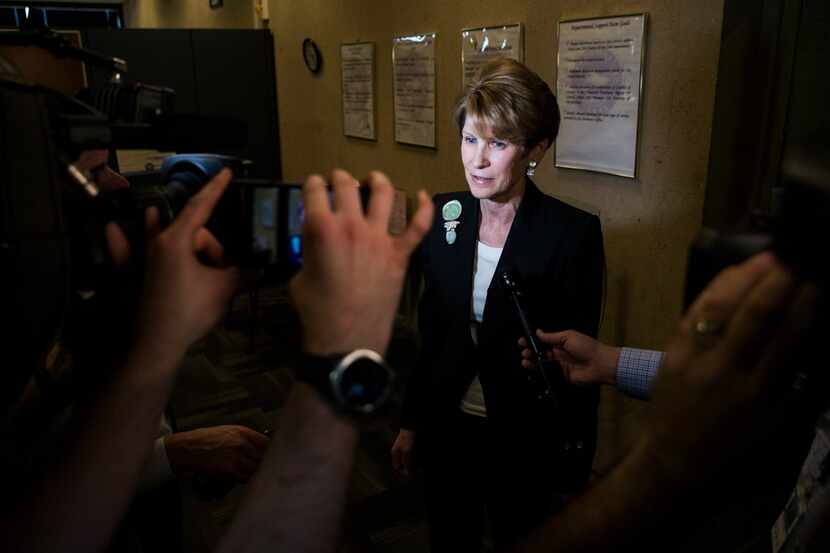 Former Dallas Mayor Laura Miller speaks to reporters as she leaves the City Secretary's...