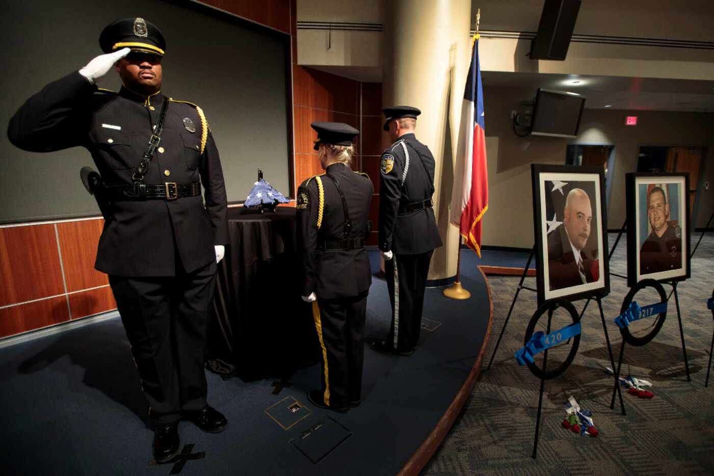 Shortly after 2 a.m. Tuesday, Dallas police Officer Londrell Tatum saluted with Senior Cpl....
