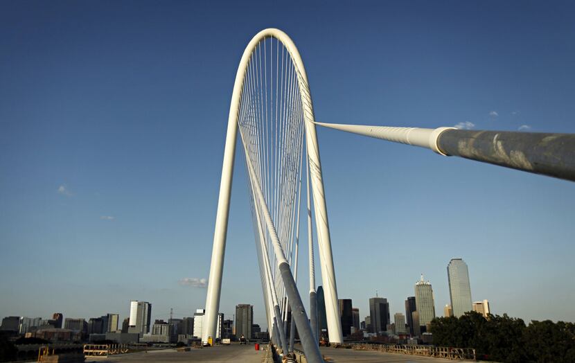 The downtown Dallas skyline is seen behind the Margaret Hunt Hill Bridge.