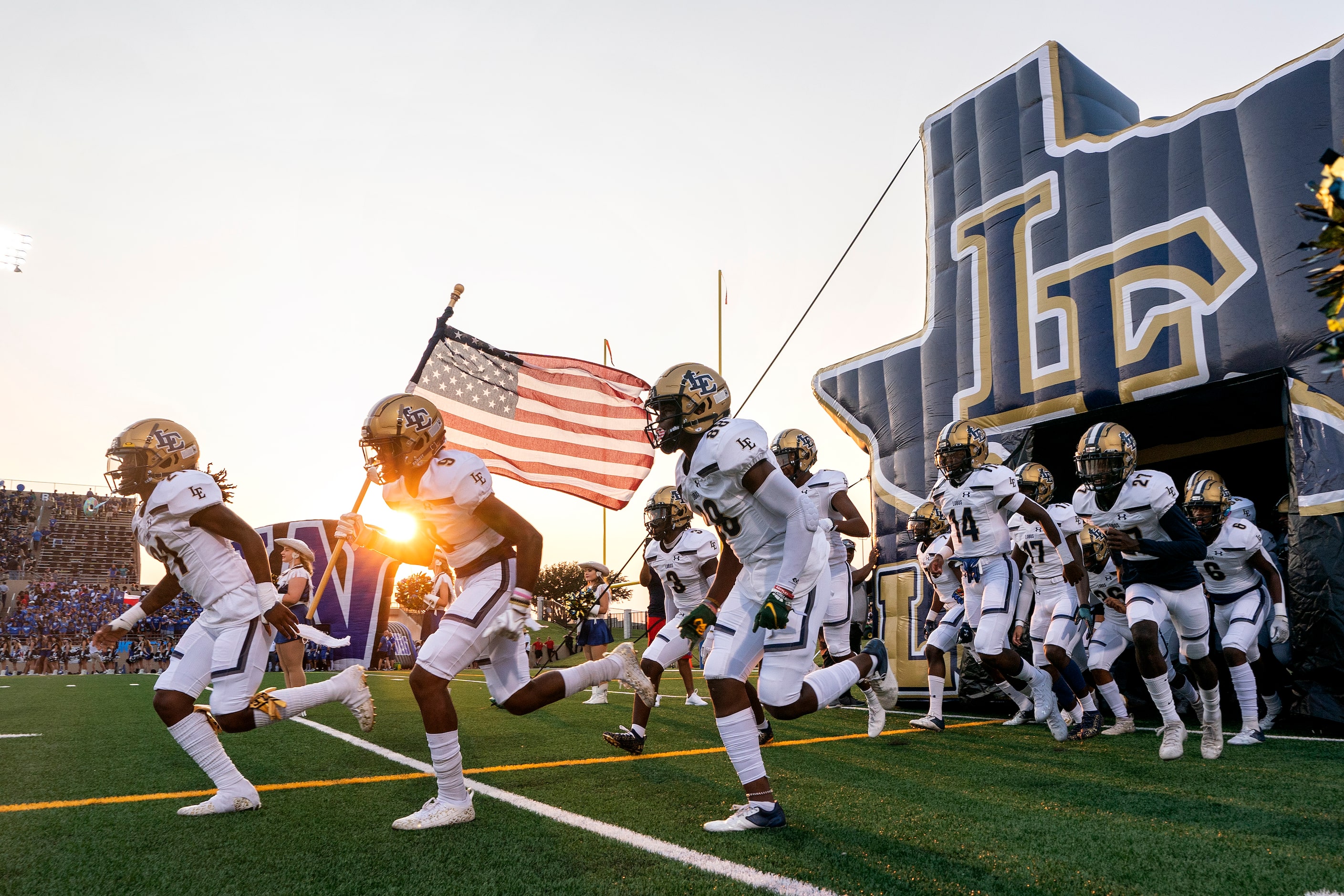 Little Elm takes the field before a high school football game against Plano West on Friday,...