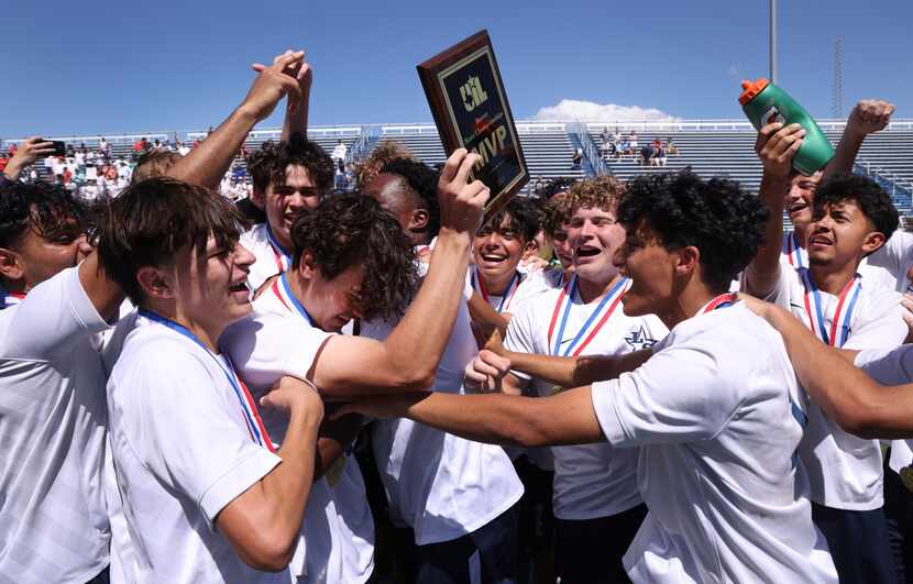 Frisco Lone Star players mob forward Bartek Zabek (11) after he was awarded the MVP plaque...