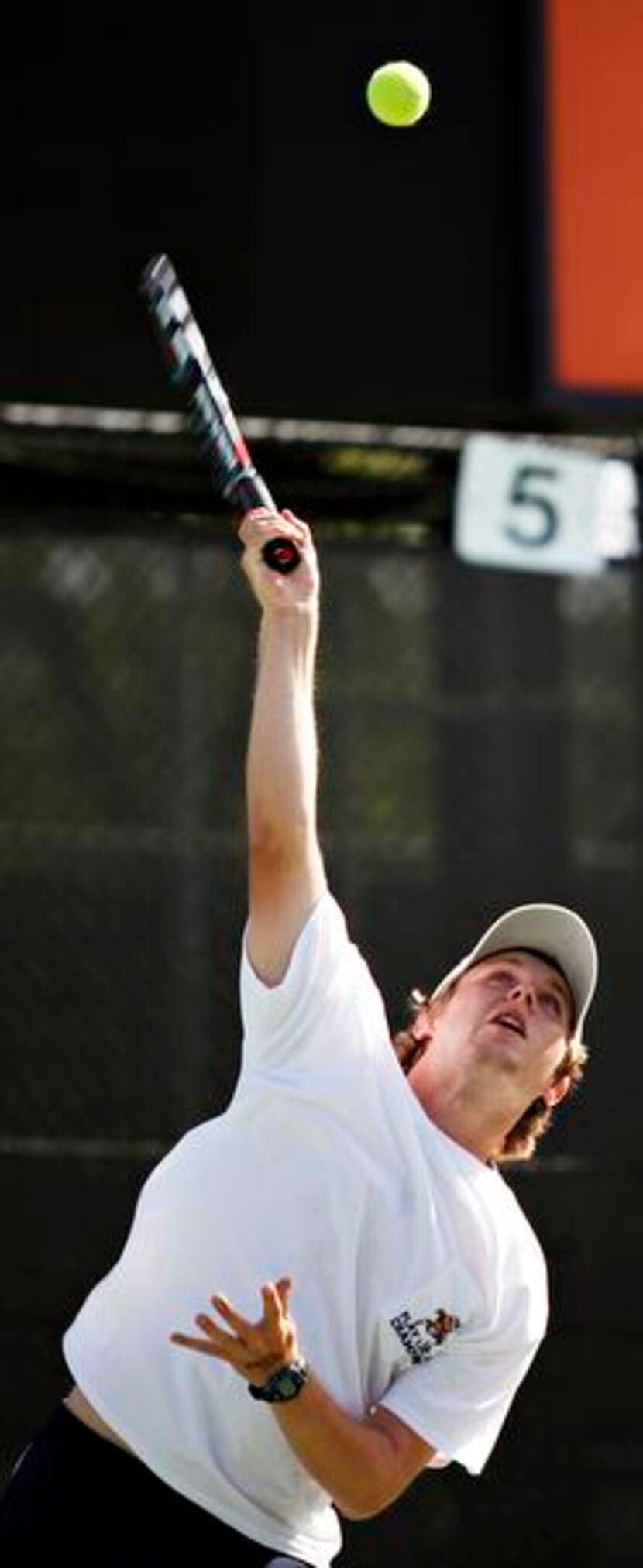 McCullough throws up a serve during his mixed-doubles final with Tedford.