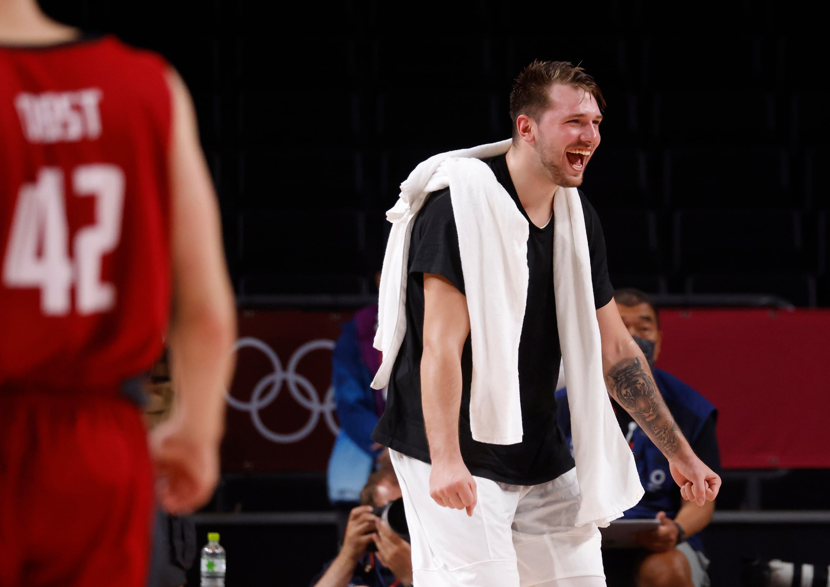 Slovenia’s Luka Doncic (77) celebrates after a made basket as they play Germany during the...