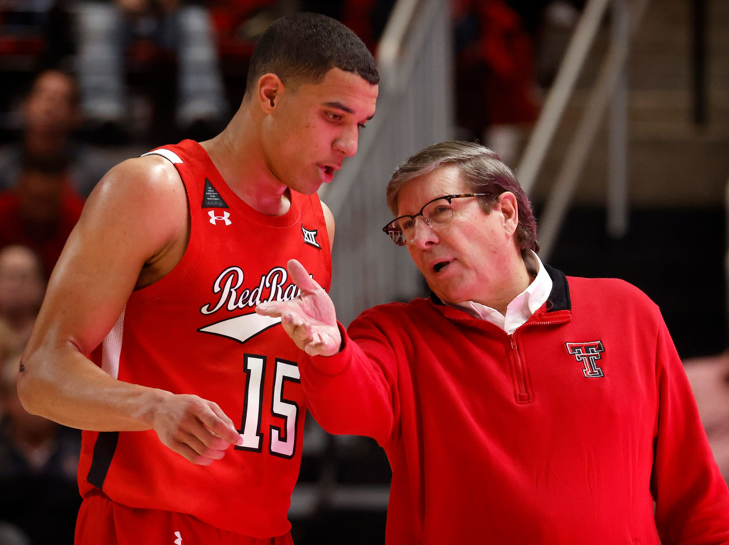 Texas Tech Red Raiders head coach Mark Adams gives instruction to guard Kevin McCullar (15)...