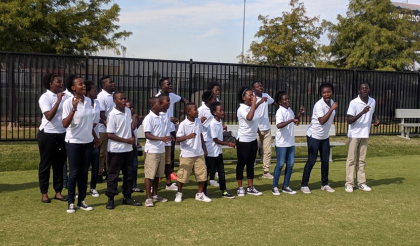 Imani Milele Choir from Uganda performs for players, coaches, and staff after FC Dallas...