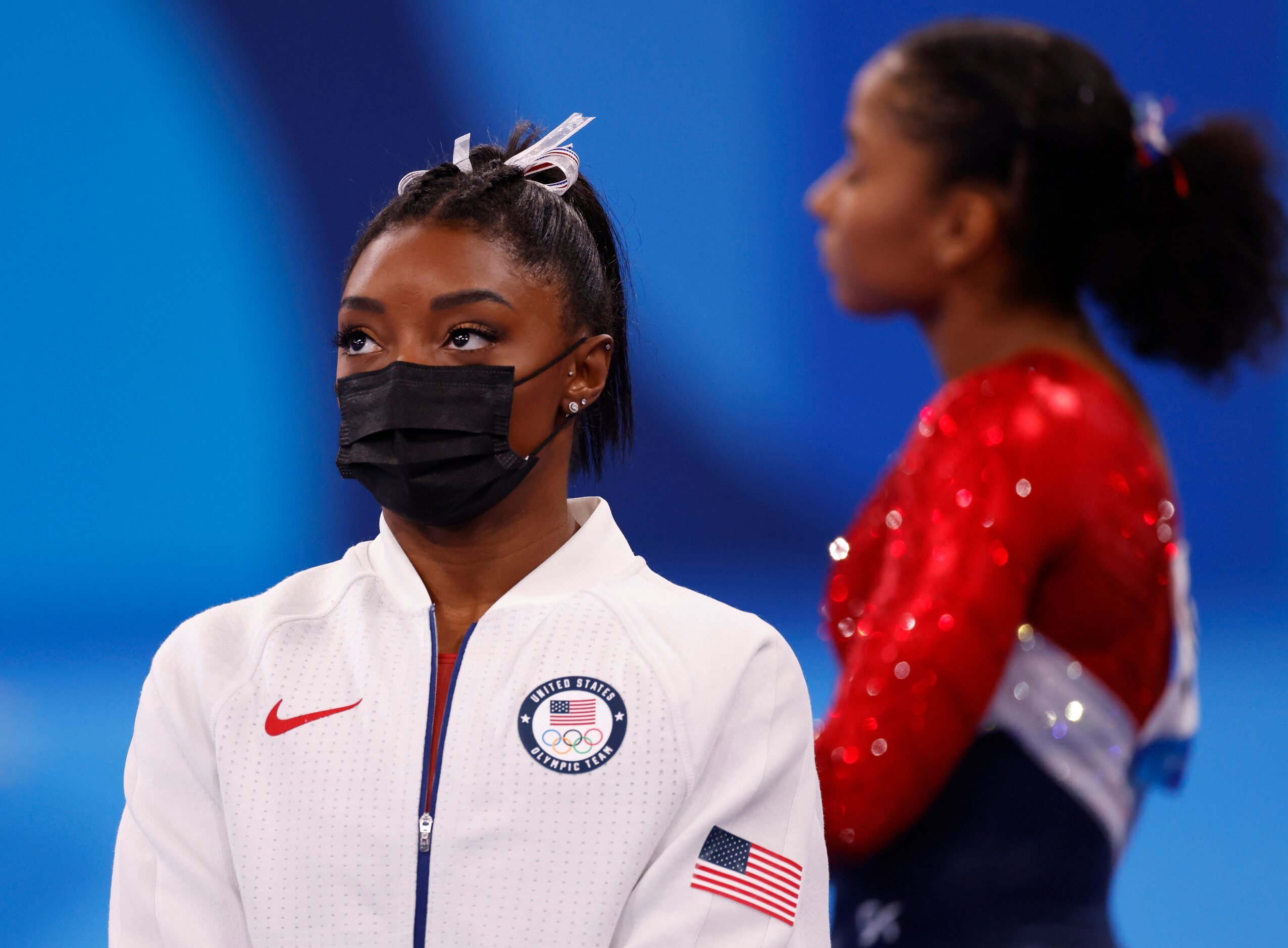 USA’s Simone Biles watches after pulling out of the competition after the vault event during...