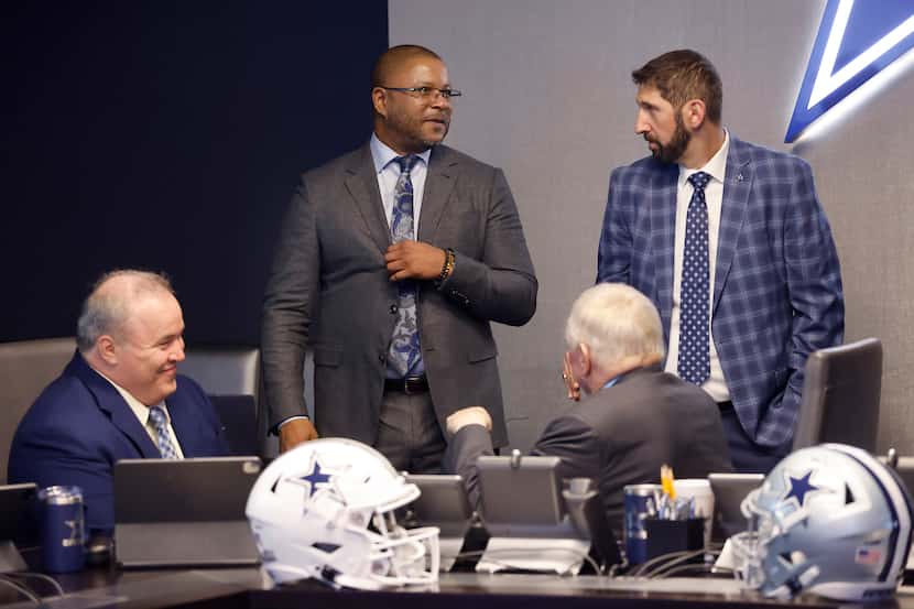 Dallas Cowboys Vice President of Player Personnel Will McClay (standing left) and Director...