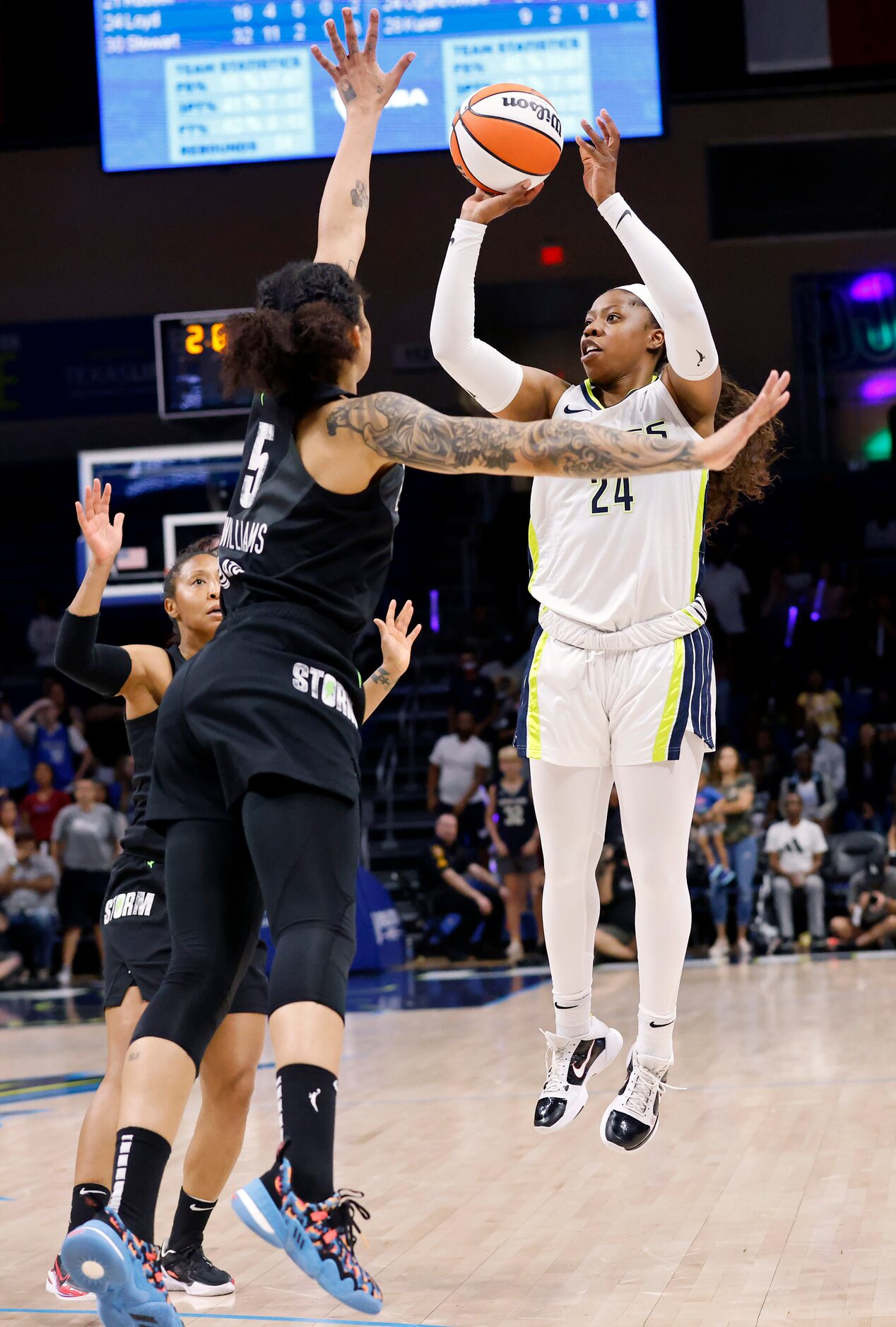 Dallas Wings guard Arike Ogunbowale (24) takes a last second shot against the Seattle Storm...