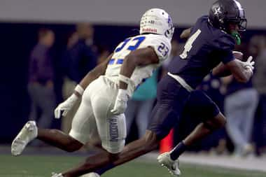 Frisco Lone Star receiver Bryson Jones (4), right, tacks on extra yardage after the catch as...