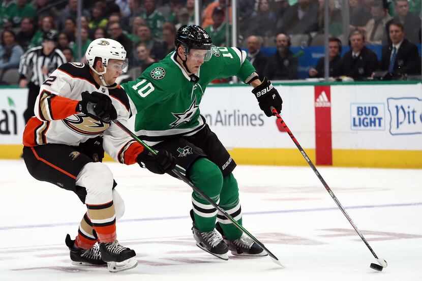 DALLAS, TEXAS - OCTOBER 24:  Corey Perry #10 of the Dallas Stars skates the puck against...