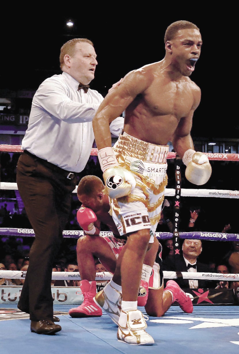 Errol Spence Jr. reacts after knocking down Kell Brook in their IBF Welterweight World...