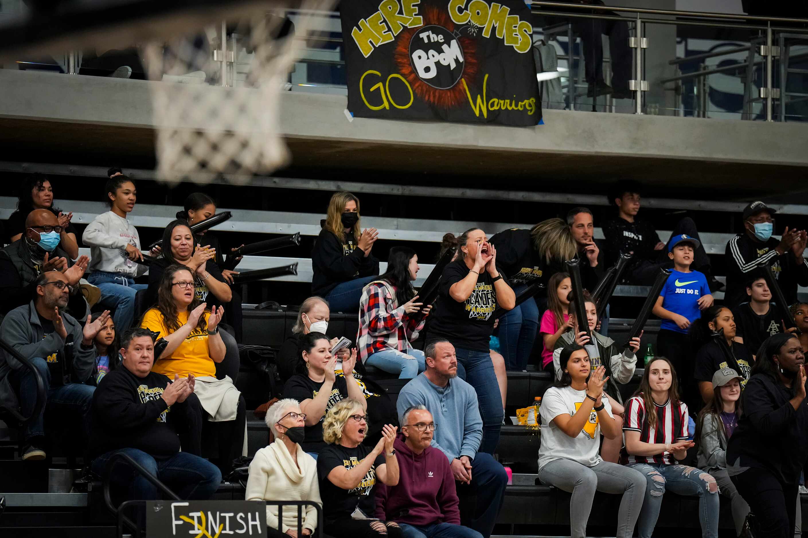 Frisco Memorial fans cheer their team during a Class 5A first-round high school basketball...