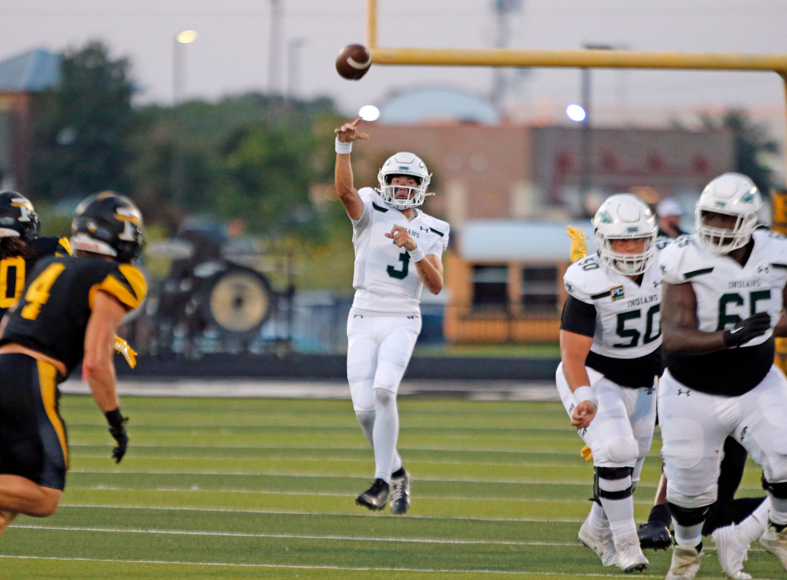 Waxahachie QB Jerry Meyer III (3) throws a pass during the first half of a high school...