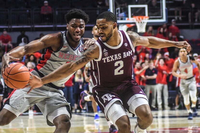 Texas A&M's TJ Starks (2) steals the ball from Mississippi guard Blake Hinson (0) during an...