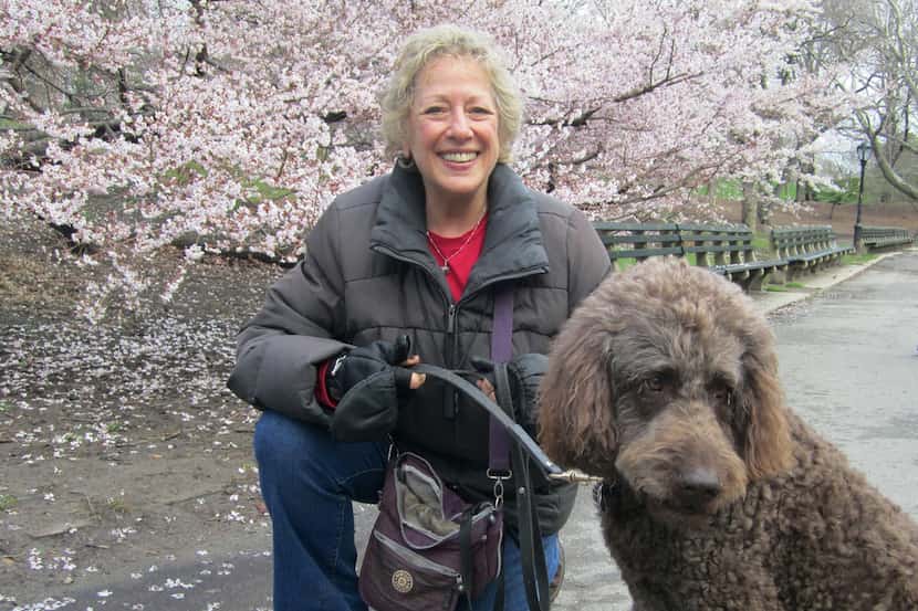 In this April 2014 photo provided by B.L. Ochman, Ochman poses with dog Benny, an 80-pound...