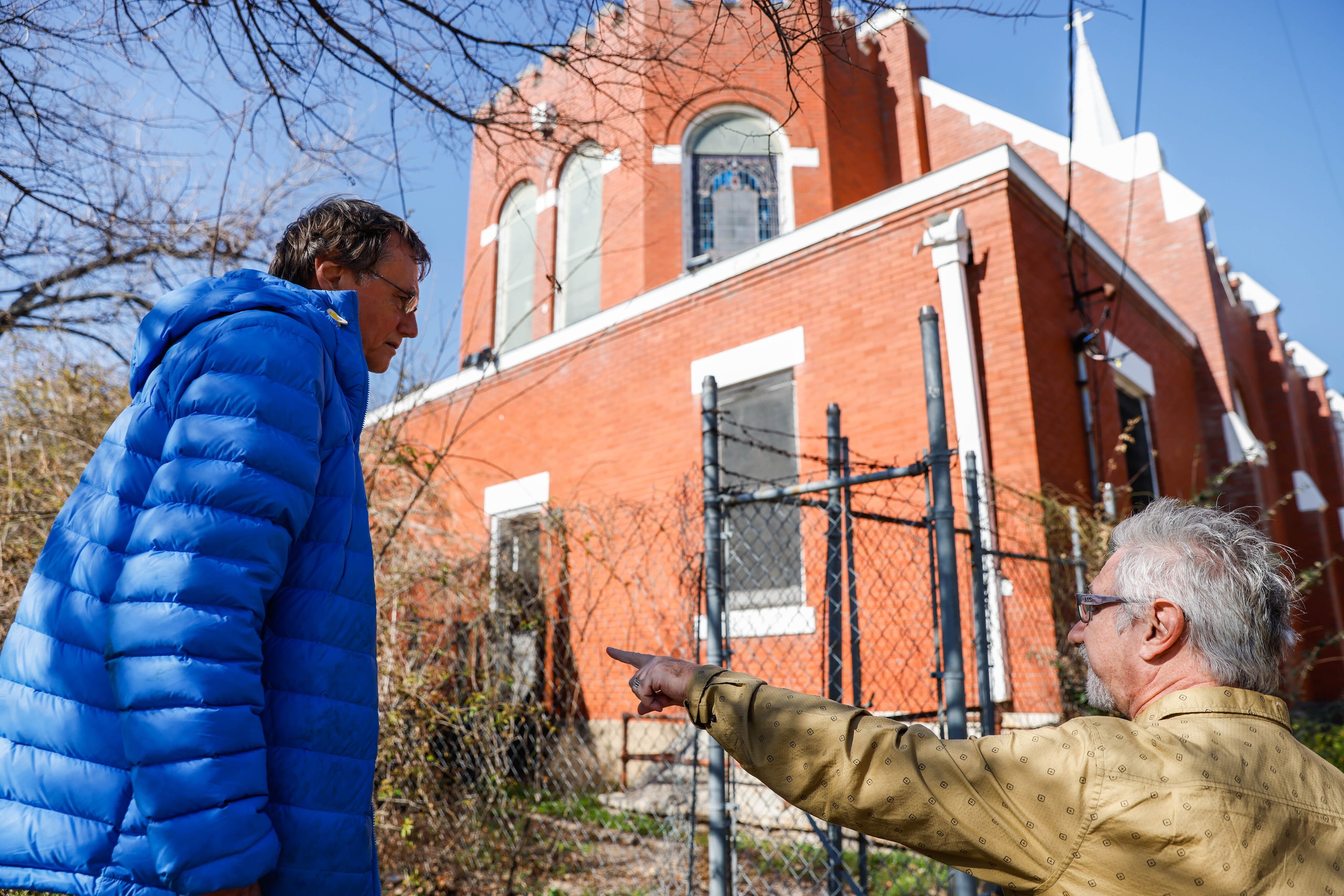 Jim Anderson, right, talks about structural damage at the former St Joseph’s Catholic Church...