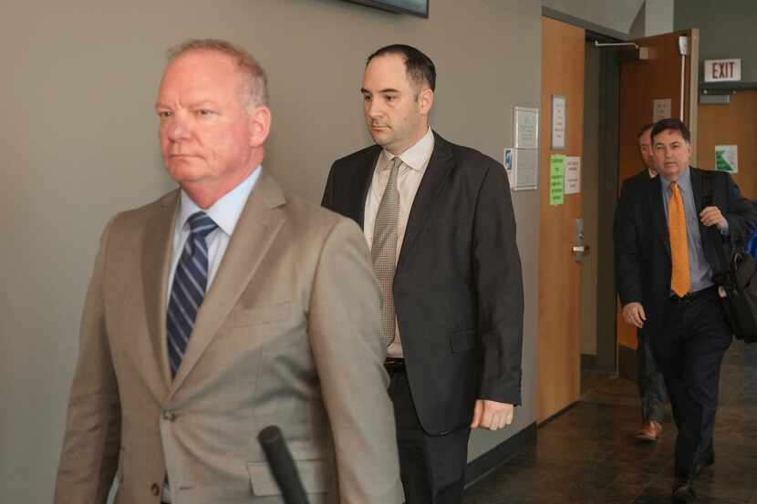 U.S. Army Sgt. Daniel Perry, center, and his attorney Doug O'Connell, left, walked out of...