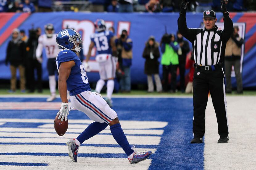 New York Giants wide receiver Sterling Shepard (87) slows his forward motion after catching...