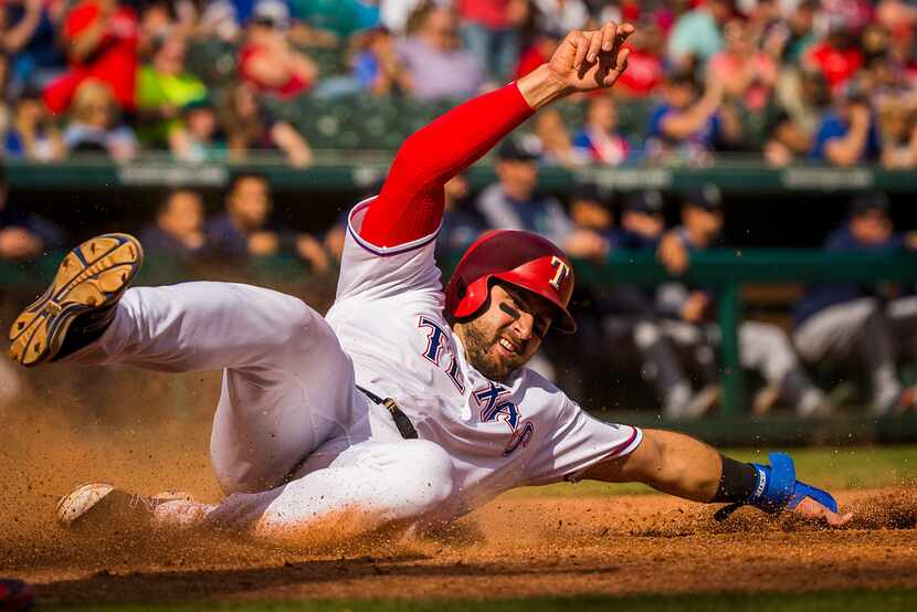 Texas Rangers first baseman Joey Gallo scores from second base on a single by second baseman...