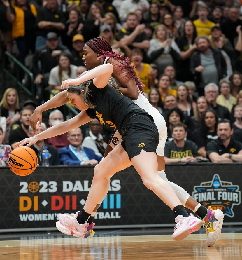 Iowa forward McKenna Warnock (14) takes the ball away from South Carolina forward Aliyah...