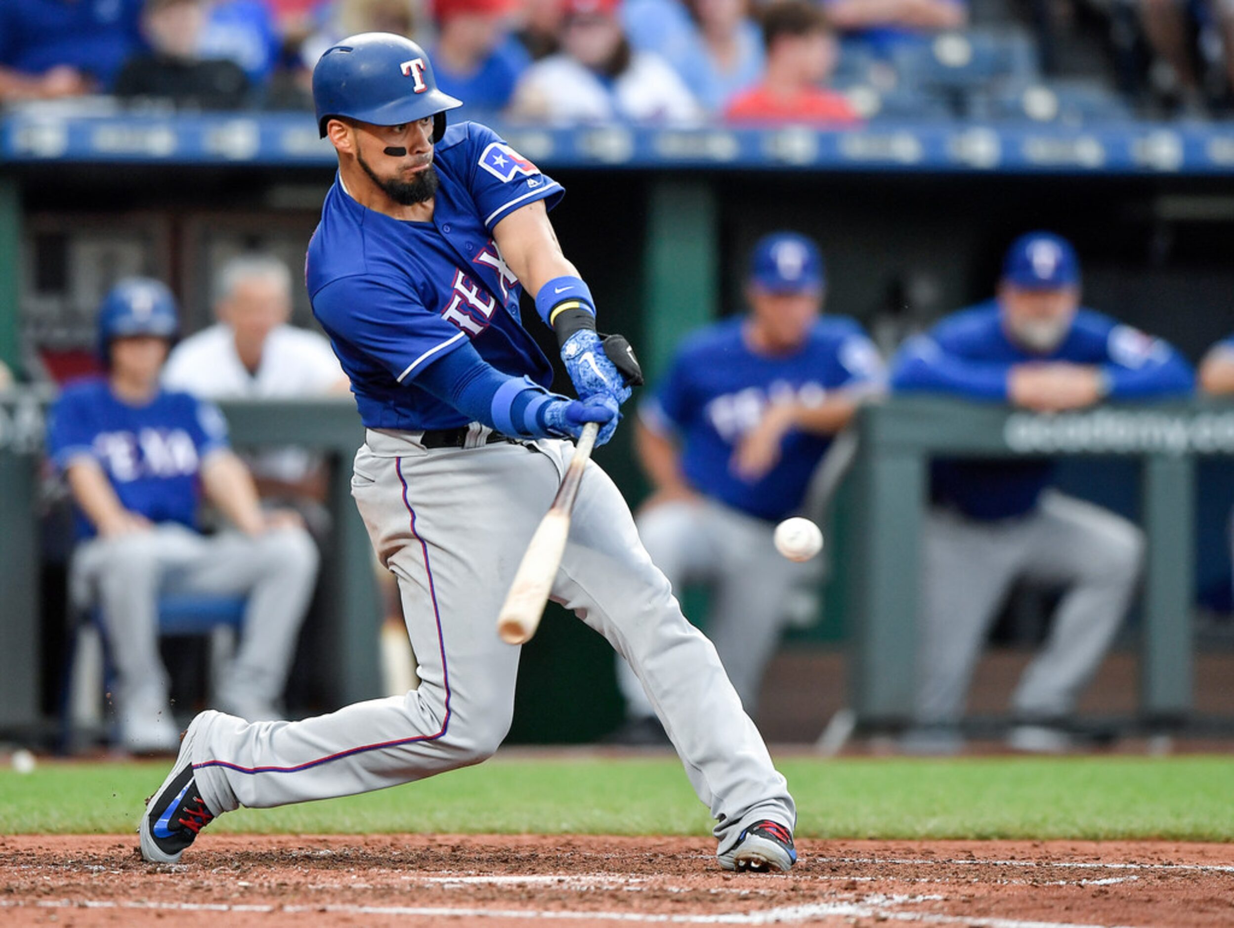 The Texas Rangers' Robinson Chirinos connects on a ground ball that turned into a fielding...